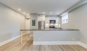 Open-concept kitchen and living area at 320 and 322 Lakeshore Road West featuring modern finishes