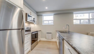 Modern kitchen with stainless steel appliances at 320 and 322 Lakeshore Road West