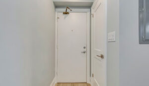 Unit entry door and hallway inside apartment at 320 and 322 Lakeshore Road West