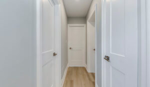 Interior hallway with bedroom and bathroom doors at 320 and 322 Lakeshore Road West apartment