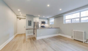 Living area facing kitchen island at 320 and 322 Lakeshore Road West
