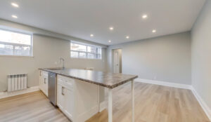 Kitchen island overlooking open living space at 320 and 322 Lakeshore Road West