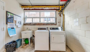 Shared laundry room with washers and dryers at 320 and 322 Lakeshore Road West