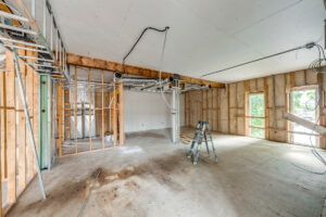 Medical office suite under development showing framed exam rooms and utility connections