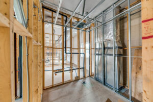 Detailed view of framed medical office interior with HVAC and electrical infrastructure installed