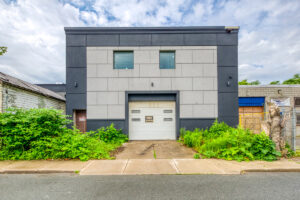 Rear exterior view of commercial medical building with service door at 401 Victoria Ave North, Hamilton