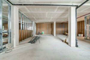 Unfinished medical office interior with open floor plan and framed walls at 401 Victoria Ave North