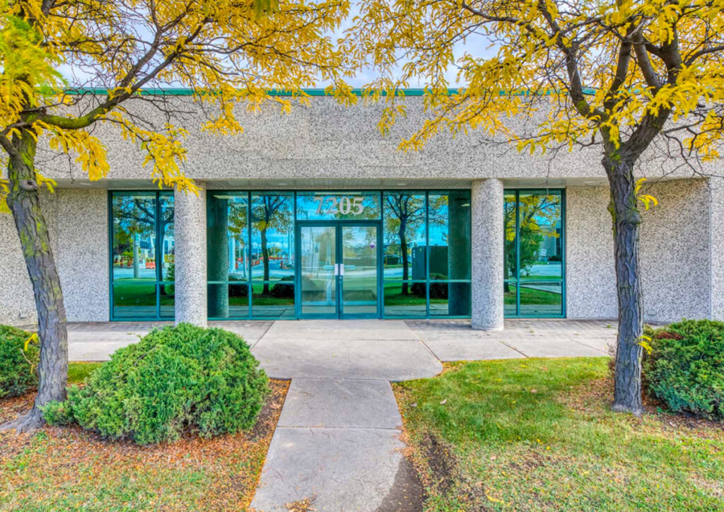 Front entrance of commercial building at 7205 Edwards Boulevard