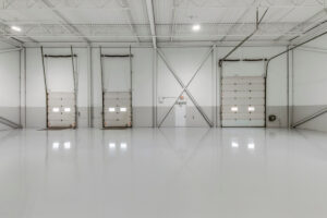 Warehouse interior with loading doors and polished concrete floor at 7205 Edwards Boulevard