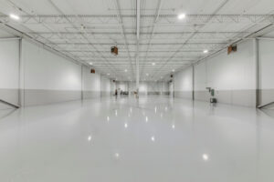 Open warehouse floor with high ceilings and LED lighting at 7205 Edwards Boulevard