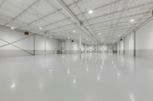 Large warehouse floor area with high bay lighting at 7205 Edwards Boulevard